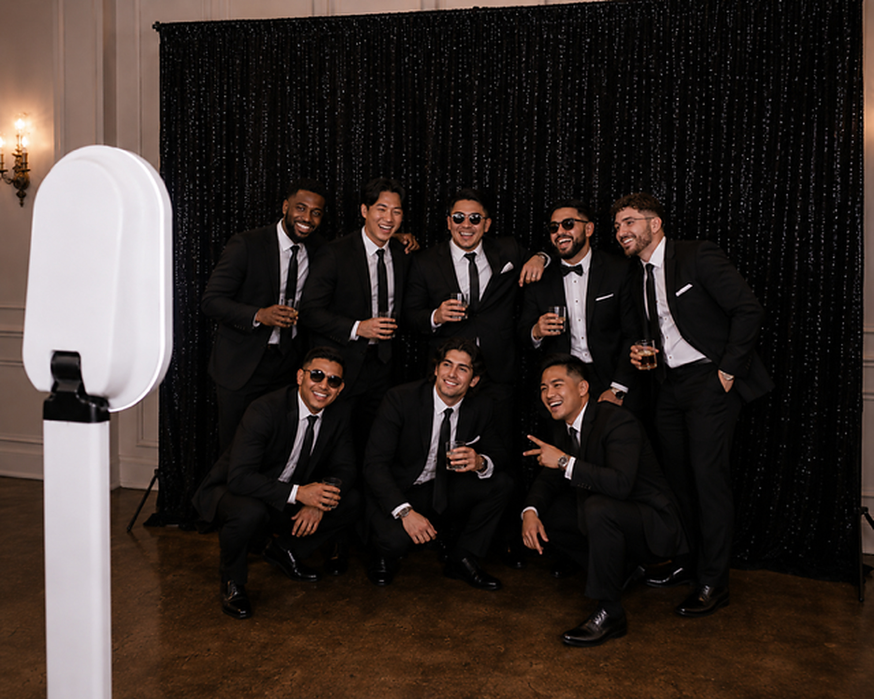 Wedding party at black sequin backdrop
