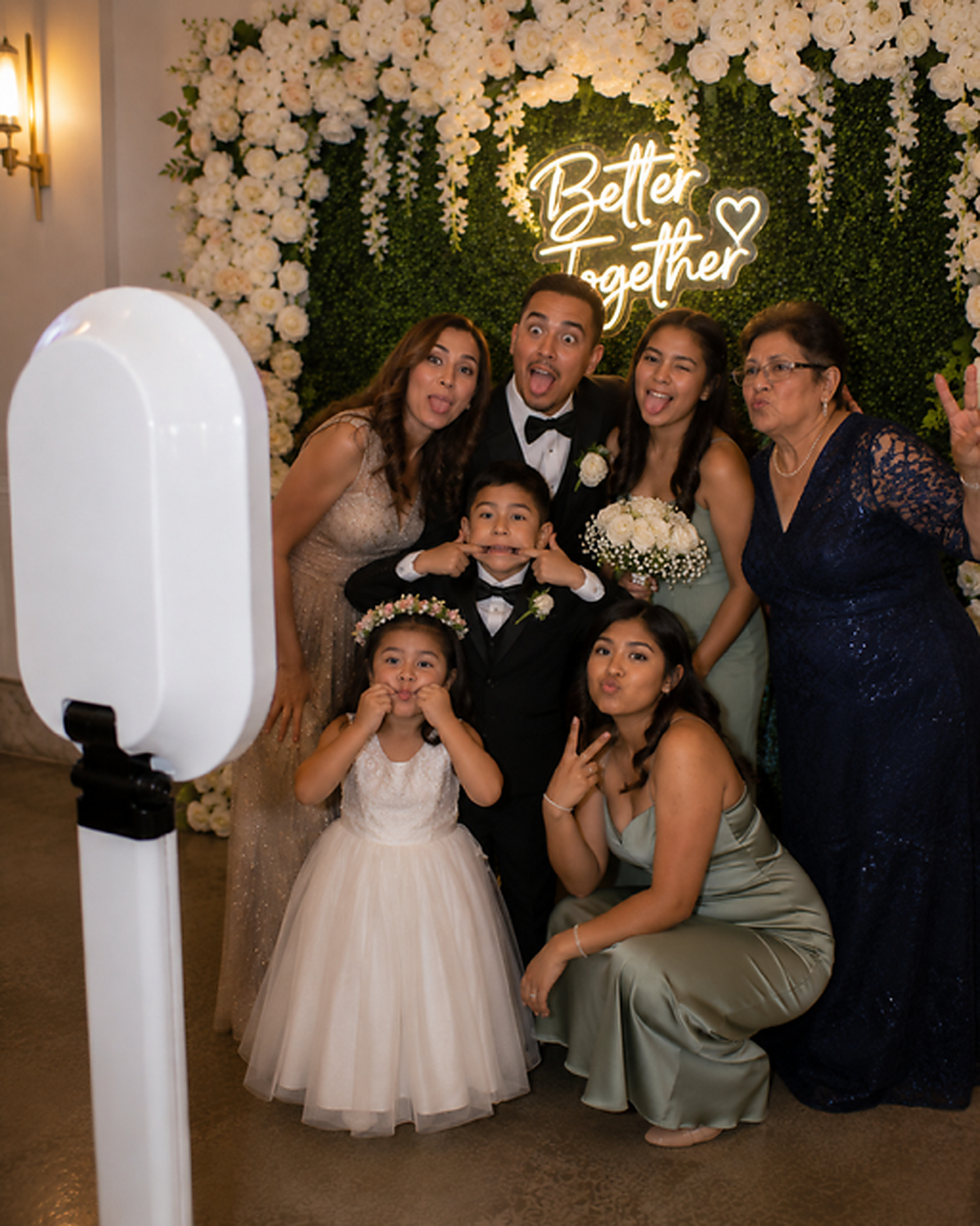 Family enjoying The Signature Photobooth at a wedding
